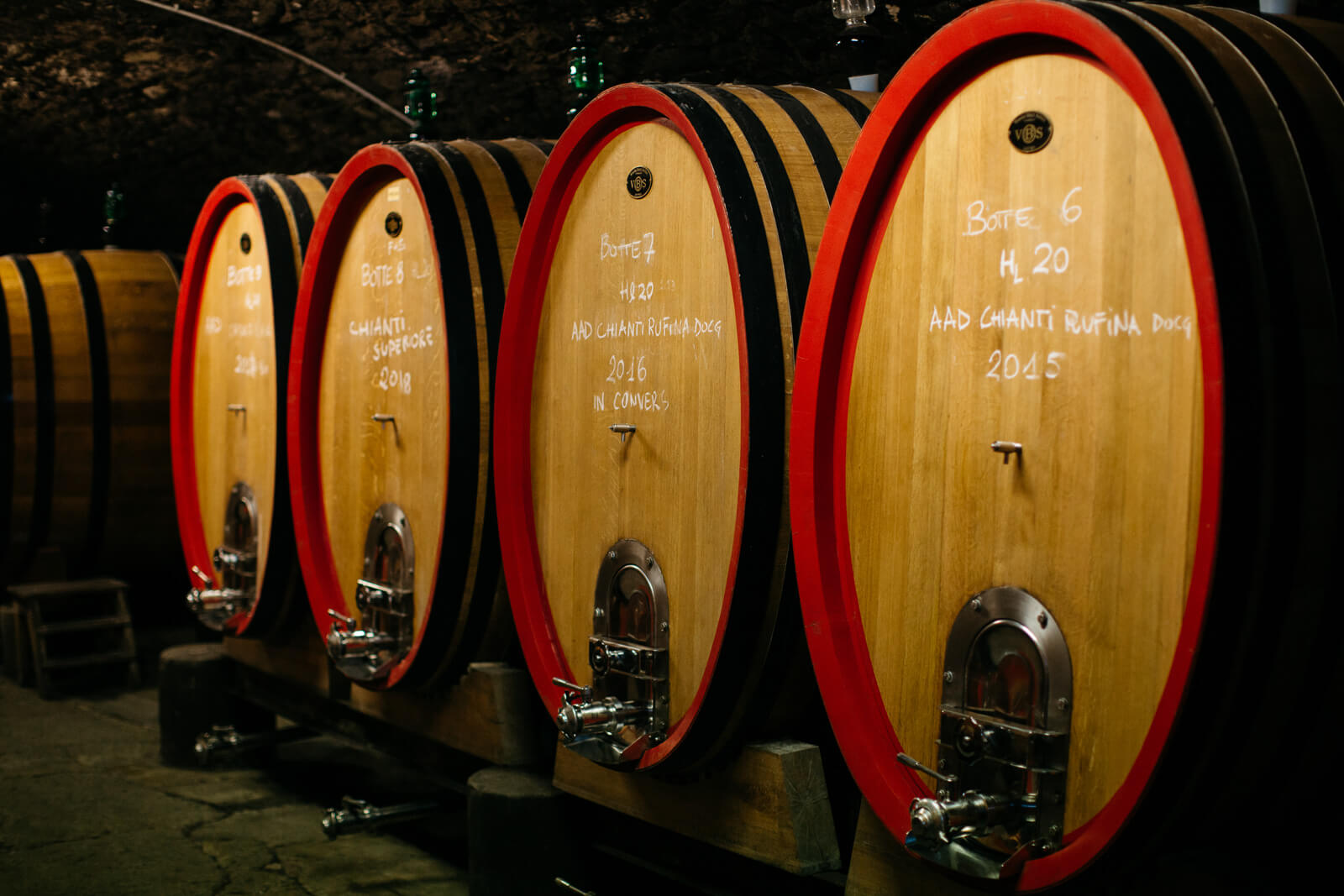 barrels of wine with writing on them